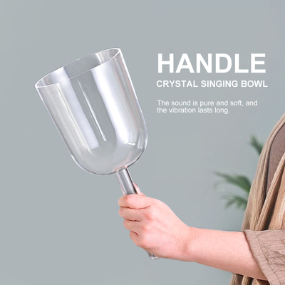 Handle clear crystal singing bowl with heavy purple carrier for sound bath
